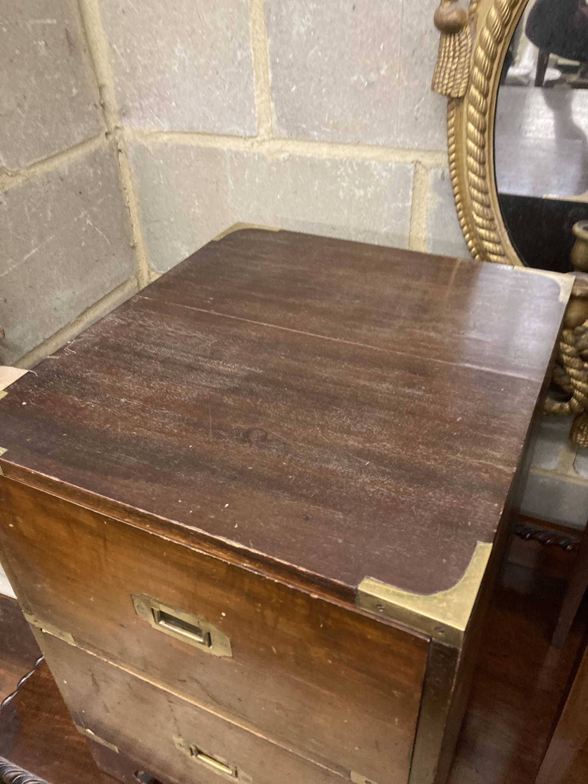 Three military style mahogany two drawer bedside chests, larger width 40cm, depth 46cm, height 56cm